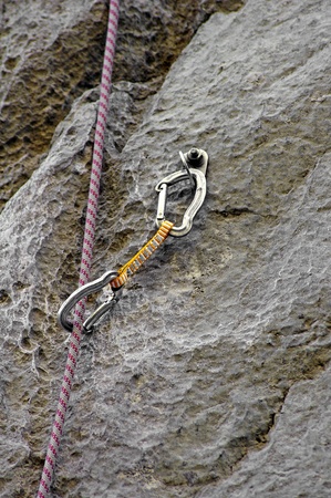 Carbine and hook with rope in stone の写真素材