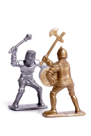 Fighting toy soldiers on a white background, knights の写真素材