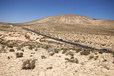 Sand dunes and mountains near Sotavento beach on Jandia peninsula, Fuerteventura, Canary Islands, Spainの写真素材