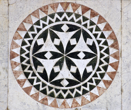 Marble ornament from wall of Cathedral of St Martin in Lucca in Italyの写真素材