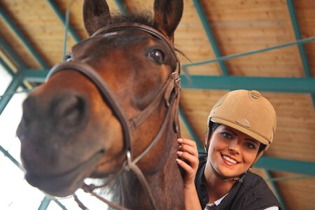 Woman In Indoor Riding Arenaの写真素材