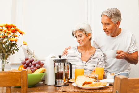 Happy Senior Couple Having Breakfastの写真素材