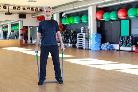 Senior Caucasian Man Working Out At The Gymの写真素材