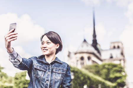 Young Chinese Female Enjoying Her Trip To Parisの写真素材
