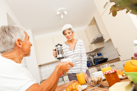 Happy Senior Couple Having Breakfastの写真素材