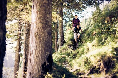 Hiking Seniors in Forestの写真素材