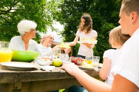 Big Family Having A Picnic In The Gardenの写真素材