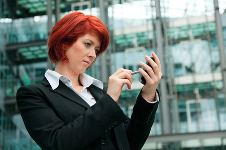 Businesswoman In Front Of An Office Buildingの写真素材