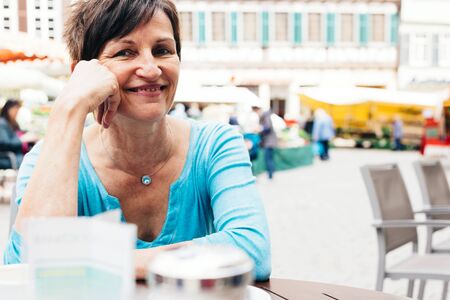 Senior Woman Enjoying A Cup Of Coffee, Tuebingen, Germanyの写真素材