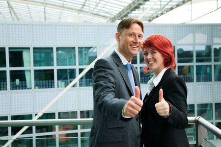 Business People In Front Of An Office Buildingの写真素材