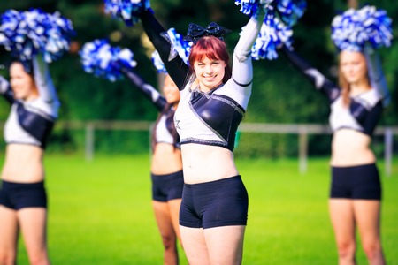 Cheerleaders Practicing Outdoors