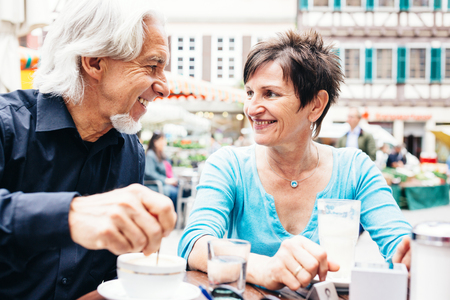 Senior Couple Enjoying A Cup Of Coffee, Tuebingen, Germanyの写真素材