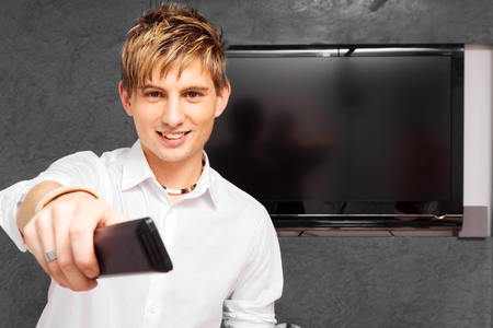 Young Man With Modern Tv Setの写真素材