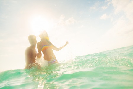 Young Couple Having Fun In The Seaの写真素材