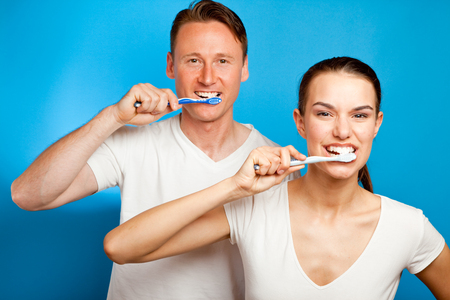 Man And Woman Brushing Their Teethの写真素材
