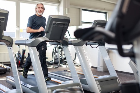 Senior Caucasian Man Working Out At The Gymの写真素材