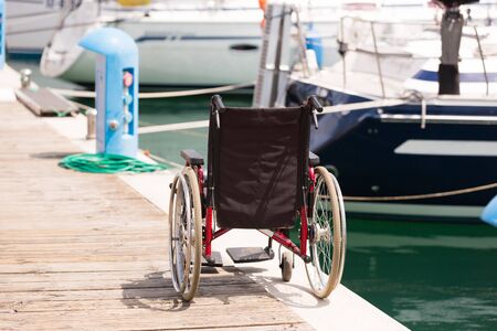 Wheelchair On Pierの写真素材