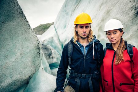 Team Of Scientists Examining A Glacierの写真素材