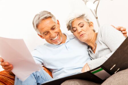 Senior Couple Doing Paperworkの写真素材