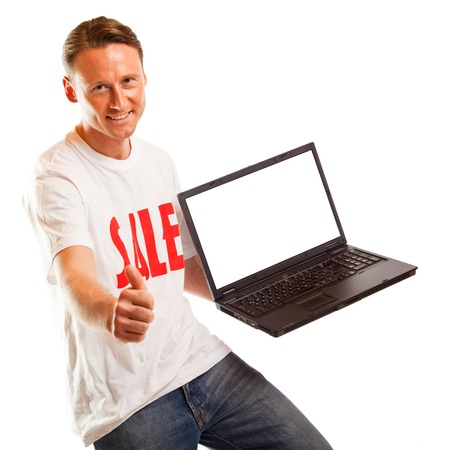 Young Man With sale T-shirt And Laptopの写真素材