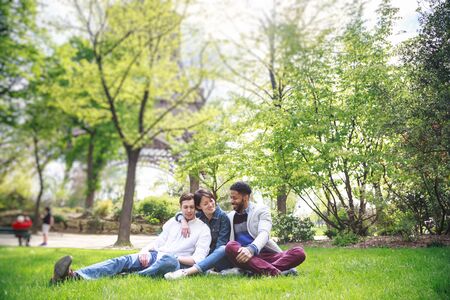 Multi-ethnic Group Of Friends Having Fun In Park Near Eiffelの写真素材