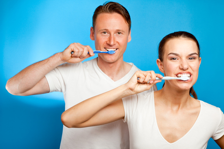 Man And Woman Brushing Their Teethの写真素材