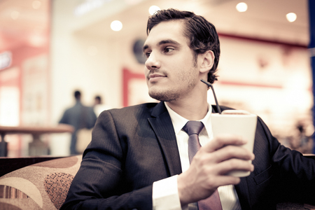 Businessman Sitting In A Cafeの写真素材