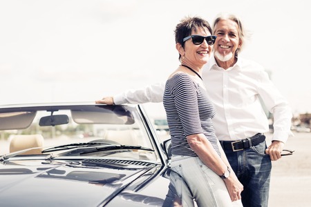 Senior Couple Standing Next To Convertible Classic Carの写真素材