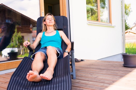 Adult Woman Relaxing On Patio