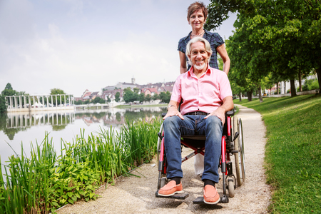 Senior Couple In Wheelchairの写真素材