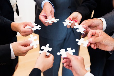 Business Team With Jigsaw Puzzleの写真素材
