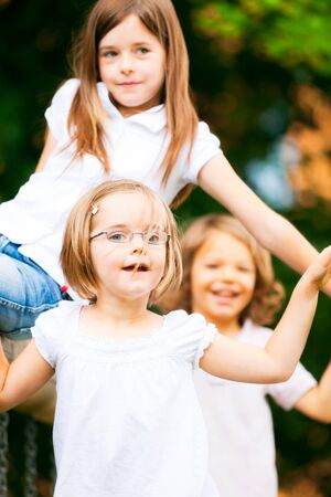 Three Kids Playing Outsideの写真素材