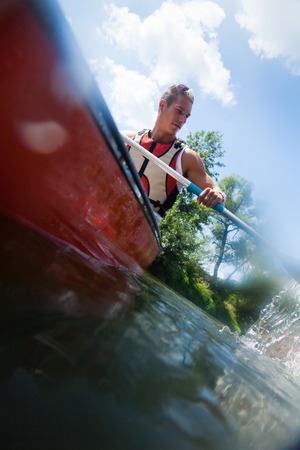 Young Man Canoeing
