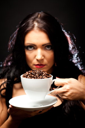 Young Woman Holding A Cup Of Coffeeの写真素材