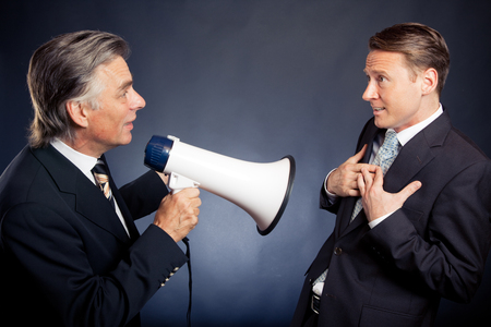 Senior Businessman Shouting At His Employeeの写真素材