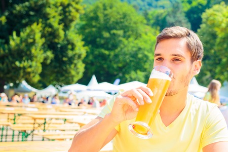 Young People Having Fun At The Beer Gardenの写真素材