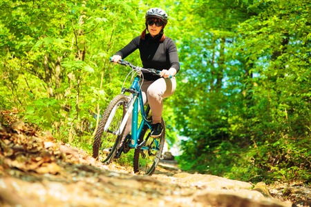 Young Woman Riding Her Mountain Bikeの写真素材