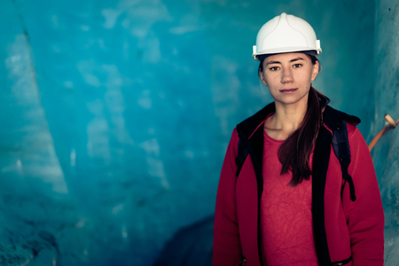 Scientist At An Expedition Site Examining A Glacierの写真素材