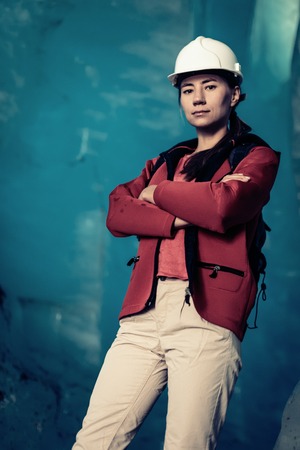 Scientist At An Expedition Site Examining A Glacierの写真素材