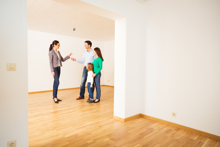 Realtor Giving Customers The Key To Their New Flatの写真素材