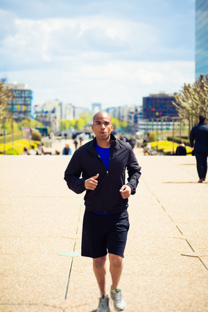 African Man Jogging In La Defense, Parisの写真素材