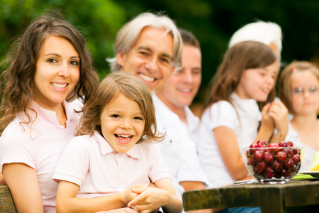 Big Family Having A Picnic In The Gardenの写真素材