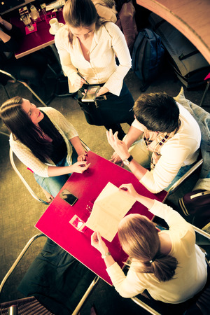 Friends Having Fun At A Cafeの写真素材