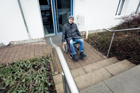 Senior Man In Wheelchair And Stairsの写真素材