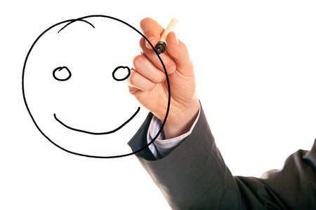 Businessman drawing a smiley faceの写真素材