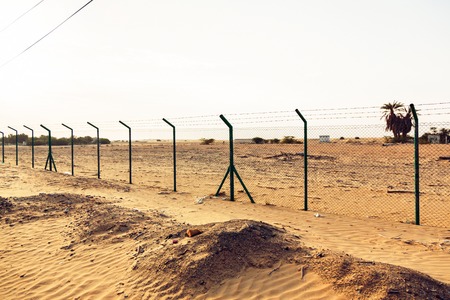 Barbed Wire Fence In The Desertの写真素材