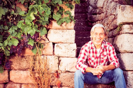 Winemaker Sitting On Stone Stepsの写真素材