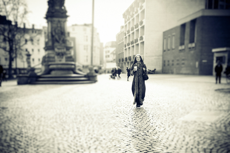 Young Woman Walking In The Cityの写真素材