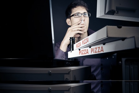 Young Man Spending His Night With Computersの写真素材