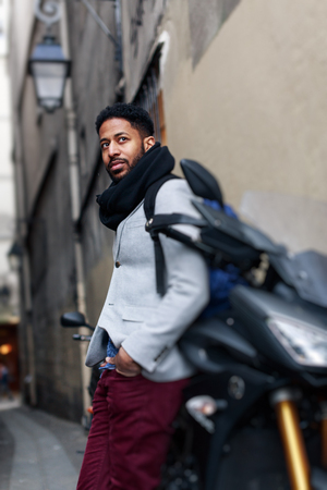 Young Black Man And His Motorcycle In Parisの写真素材